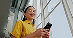 Creative business woman, phone and smile for social media, networking or texting at the office. Happy female employee worker chatting on smartphone and smiling for online career startup at workplace