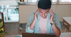Laptop, tired and stress business man in office with headache, fatigue and anxiety working online. Sad, depression and mental health problem of digital asian worker or employee burnout and depressed