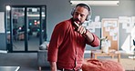 Music, dance and headphones with a business man listening to audio on his phone while walking through his office breakroom. Freedom, relax and carefree with a male employee dancing at work on break
