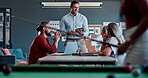 Meeting, collaboration and training with a business team talking strategy or planning behind a pool table. Teamwork, coaching and presentation with a man and woman employee group in a workshop
