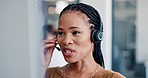 Telemarketing, call center and black woman consulting for crm, contact us and customer support in office. Customer service, woman and professional consultant with smile helping in virtual discussion