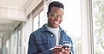 Social media, chat and black man laughing at a phone with communication, comic video and meme. Email, happiness and African person reading a funny conversation on a mobile app on a cellphone