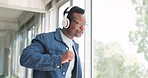 Office, headphones and business black man dance with energy, happy attitude and positive mindset. Motivation, freedom and happy male employee dancing listening to music, audio and radio in workplace