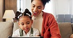 Mother, girl with tablet and learning on sofa at home for development, bonding and education with digital technology. Happy mom, kid smile together and bonding of living room couch in a family house