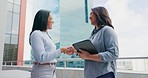 Business, women on rooftop and handshake with tablet, collaboration and partnership for new project. Corporate, female employees talking and coworkers outdoor, digital planning and website launch