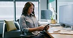 Digital tablet, office and business woman doing research for a corporate project by her desk. Technology, internet and professional female employee working on company report or proposal at workplace.