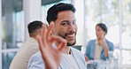 Ok hand sign, business man face and success in a office with company staff and smile. Happiness, employee portrait and motivation of a corporate manager ready for professional work in a workplace