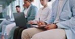 Recruitment, row and business people writing in notebook for hiring, job interview or work opportunity. Human resources, onboarding and candidates sitting with book, typing on laptop and write notes