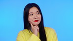 Ideas, thinking and asian woman isolated on blue background scholarship, creative or university decision. Contemplating, inspiration and person, model or student with thoughtful idea in studio mockup