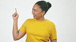 Choice, pointing and happy with face of black woman for decision, promotion and announcement. News, notification and alert with girl and hand gesture for sign, guess and surprise in studio background