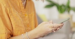 Woman, hands and phone chatting in social media for communication, texting or browsing at home. Female typing on smartphone for networking, streaming or online on mobile app or search indoors