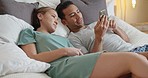 Couple in bed, social media with smartphone and smile at funny online meme posts in bedroom together. Happy man with phone, woman smiling with happiness at home and relax together on weekend morning