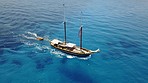 Travel, sea landscape and boat in ocean on cruise, holiday and summer vacation on luxury transport. Sailing, nature and aerial drone view of yacht for tropical adventure, freedom and island traveling