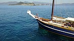 Sea, travel and people sailing on a boat outdoor in nature during a summer day for holiday or vacation. Water, yacht or luxury with men and women enjoying a cruise on the open ocean for adventure