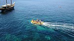 Travel, aerial and people in speed boat in ocean for cruise, holiday and summer vacation by island. Transport, sea landscape and drone top view of yacht for tropical adventure, freedom and traveling