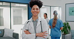 Proud face of black woman doctor in busy hospital for healthcare services, leadership and happy career mindset. Confident portrait a young medical professional or female in clinic for health care job