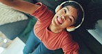 Woman, dancing and listening to music on sofa with zoom out on planet earth in global networking or streaming at home. Female dancer enjoying audio soundtrack on living room couch upside down indoors