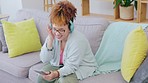 Black woman, music headphones and dancing on couch with smile, happiness and relax in home living room. Gen z girl, streaming and audio electronics for radio, dance and happy for song on internet app