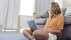 Search, laptop and busy with woman on living room floor for relax, website and browsing online. Social media, studying and freelancer with girl typing at home for technology, email and internet 