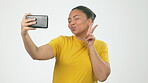 Happy woman, peace sign and selfie smile for vlog or profile picture against gray studio background. Friendly female  smiling or posing for photo, emoji or facial expression in social media on mockup