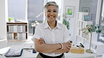 Business woman, face and smile with arms crossed in office, corporate company or management in Colombia. Portrait of mature female executive for leadership, professional trust or happiness in startup