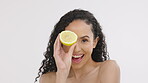 Beauty, woman and lemon fruit portrait for skincare in studio with vitamin c dermatology cosmetics. Aesthetic model person on white background with healthy food for self care, facial and natural glow