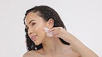 Black woman, face and cosmetics, facial gua sha and tools, beauty and skincare isolated on studio background. Female, healthy skin glow, exfoliate and spa treatment with self care cosmetic massage