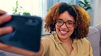 Phone, selfie and black woman with hand, peace and sign on a sofa, happy and smile in her home. Face, girl and social media influencer with emoji hand on a couch for photo, profile picture or blog