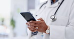 Doctor, woman and hands with phone for healthcare research, browsing or zoom at the hospital. Hand of female medical professional on smartphone app typing, texting or online search for life insurance