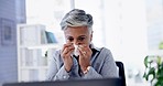 Sick, tissue and woman sneezing in the office with flu, cold or allergies while working on project. Illness, medical emergency and professional senior female employee blowing her nose in workplace.