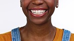 Black woman, teeth and smile for dental care, whitening or healthcare against a white studio background. Happy isolated African American female smiling for tooth, mouth or gum and oral hygiene