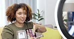 Black woman, cosmetic influencer and video tutorial with foundation palette, smile and beauty on social media. Gen z girl, digital makeup expert or online self care teaching for face product on web