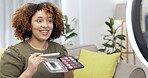 Black woman, cosmetics influencer and video tutorial with foundation palette, smile or beauty on social network. Gen z girl, digital makeup expert or online self care teaching for face product on web