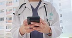 Hands, phone and doctor typing message, email or checking online schedule at hospital. Technology zoom, communication and connect on medical social media post or internet search for healthcare advice