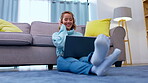 Music, laptop and woman with headphones in living room for streaming audio, radio or podcast. Computer, relax and happy female sitting on floor, dance and listening to song, sound or album in house.