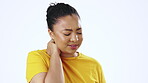 Stress, tension and neck pain with a black woman in studio isolated on a white background feeling sore or hurt. Strain, pressure and stiff with a young female rubbing her spine on blank wall space