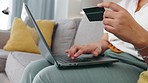 Credit card, online shopping and computer with digital shop app for cyber purchase at home. Living room sofa, web paying security information and female typing banking code for ecoomerce in a house