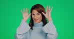 Face, funny and woman with tongue out on green screen in studio isolated on a background mockup. Comic, silly and happy female model with goofy, fun and crazy facial expression on chroma key backdrop