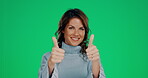 Woman, face and smile with thumbs up for winning, good job or success against a green studio background. Portrait of happy female showing thumb emoji, yes sign or like in support, trust or agreement