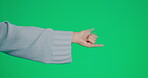 Hand, shaka and a woman on a green screen background in studio to gesture a social media emoji. Surfs up, sign and symbol with an unrecognizable person on chromakey mockup space for branding