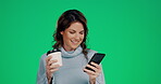 Phone, coffee and laughing with a woman on a green screen background in studio reading a text message. Social media, contact and mobile with a female looking at a meme on a color wall for mockup