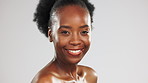 Face, beauty and laughter with a black woman turning in studio on a gray background for skincare. Portrait, aesthetic and funny with an attractive young female looking happy with cosmetic treatment