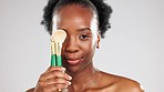 Face, makeup smile and black woman with brushes in studio isolated on a gray background. Portrait, cosmetics and happy female model with product or tools to apply foundation or powder for beauty.