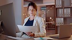 Woman, night and document, computer and work at desk with data analysis and statistics for report. Analyst review paperwork, female working late and deadline, reading and research with information