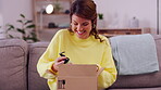 Happy woman, box and ecommerce delivery on sofa unpacking package, cargo or order in living room at home. Female customer smiling for delivered beauty products from online shopping purchase or parcel