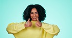 Thumbs up, smile and face of black woman on blue background for success, celebration and victory. Happy, comic emoji and portrait of girl in studio for thank you, support and agreement hand gesture