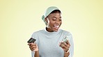 Cellphone, credit card and black woman in a studio doing online shopping for sale or discount. Happy, smile and African female buying from ecommerce retail website with cellphone by yellow background