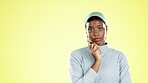 Annoyed, thinking and face of a black woman in studio with pensive, contemplating and moody expression. Upset, angry and portrait of a female with thoughtful gesture by yellow background with mockup.