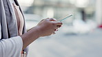 Texting, phone and hands of woman in city for networking, social media app and connection. Technology, internet and website with girl browsing online in town for search, travel and communication