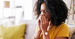 Black woman, blowing nose and tissue in home for flu, tired or medical problem on lounge couch. Girl, health and toilet paper for allergy, sinus or sick on sofa, living room and frustrated in house